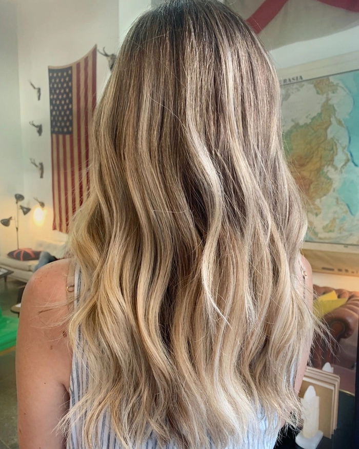 Balayage beach wave styling with soft, sun-kissed highlights