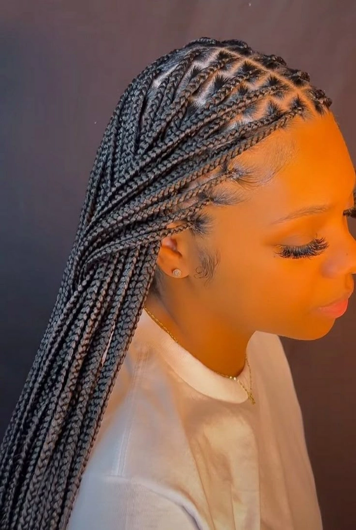 Woman with extra long beach braids on the shore