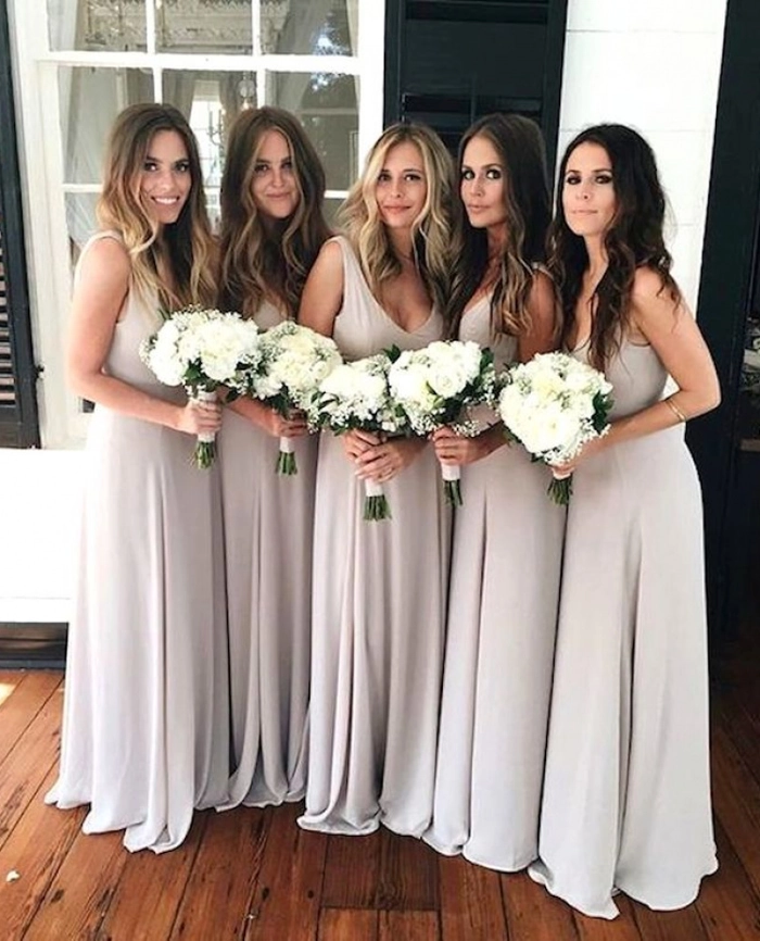 Beach bridesmaid hair concepts image 9 showcasing effortless seaside styles Stylish beach bridesmaid hairstyles with flowing waves and floral accents