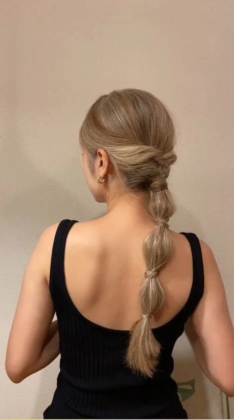 Side beach bubble ponytail with loose waves