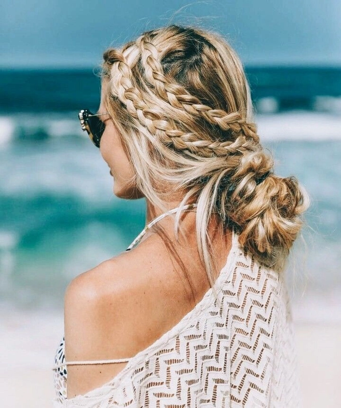 Beach crown braid hairstyle perfect for a sunny day out Crown braid style with soft waves woven around the head for a beachy look