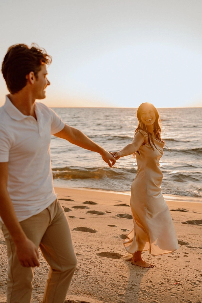 Coastal engagement hairstyle featuring soft braids and sea-inspired accessories Trendy updo for a beach engagement session with loose waves and delicate flowers