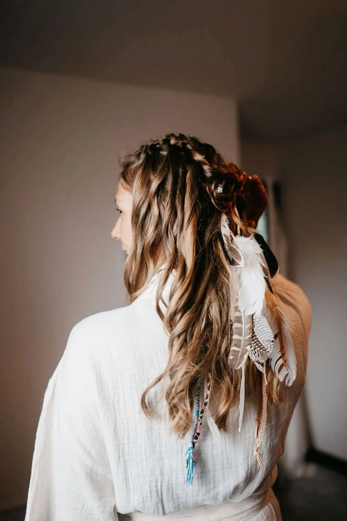 Woman with bohemian beach waves and floral crown at a seaside festival
