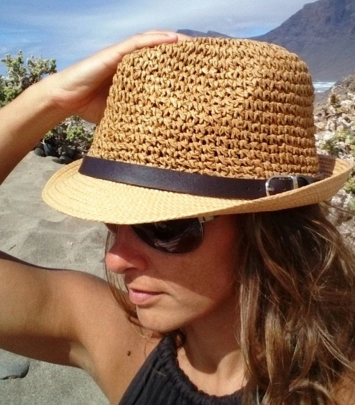 Braided beach hairstyle perfect for keeping hair tidy under a sun hat