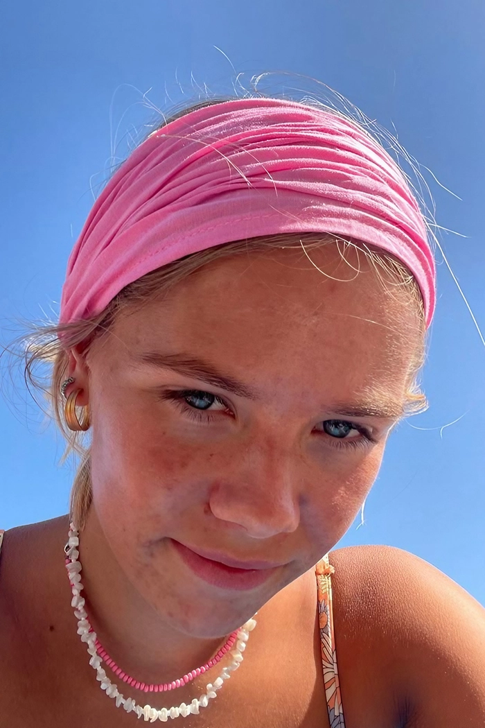 Effortless beach hairstyles designed for wearing hats without ruining your waves
