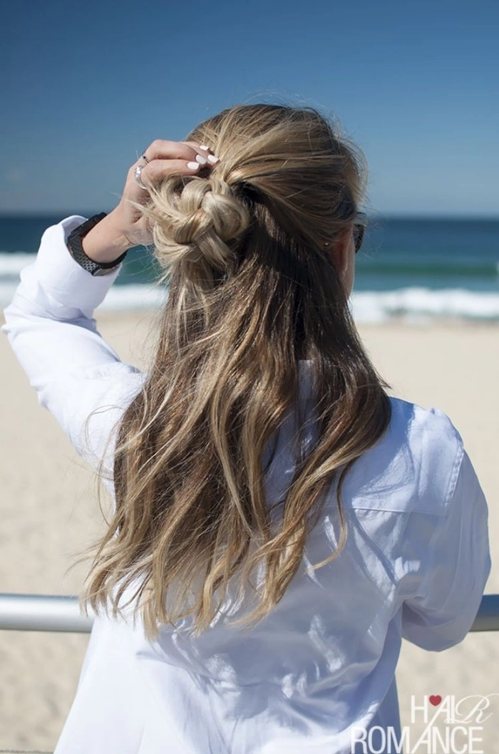 Elegant beach hairstyle featuring minimalist metal cuffs Beach hair with minimalist metal cuffs