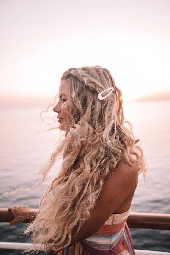 Minimalist metal cuffs accenting windswept beach hair Relaxed beach waves accessorized with minimalist metal cuffs
