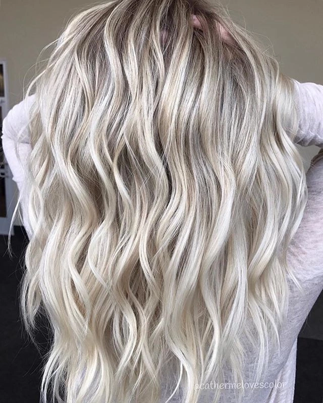 Platinum blonde beach hair tousled by ocean breeze