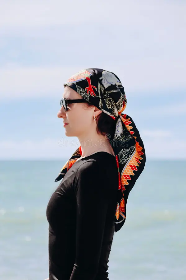 Silk scarf beach hairstyle for effortless waves beach hair with a silk scarf tied as a headband