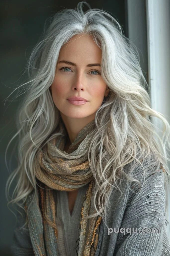 Silver gray hair styled in beach waves near the ocean
