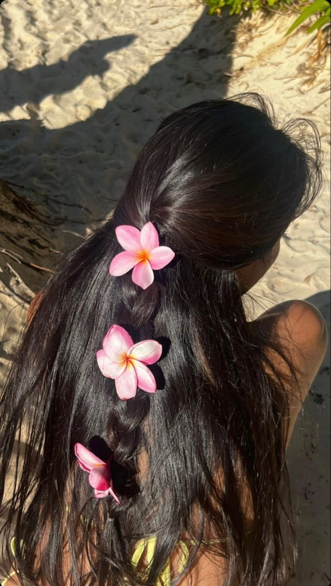 Beach hair styled with fresh tropical flowers