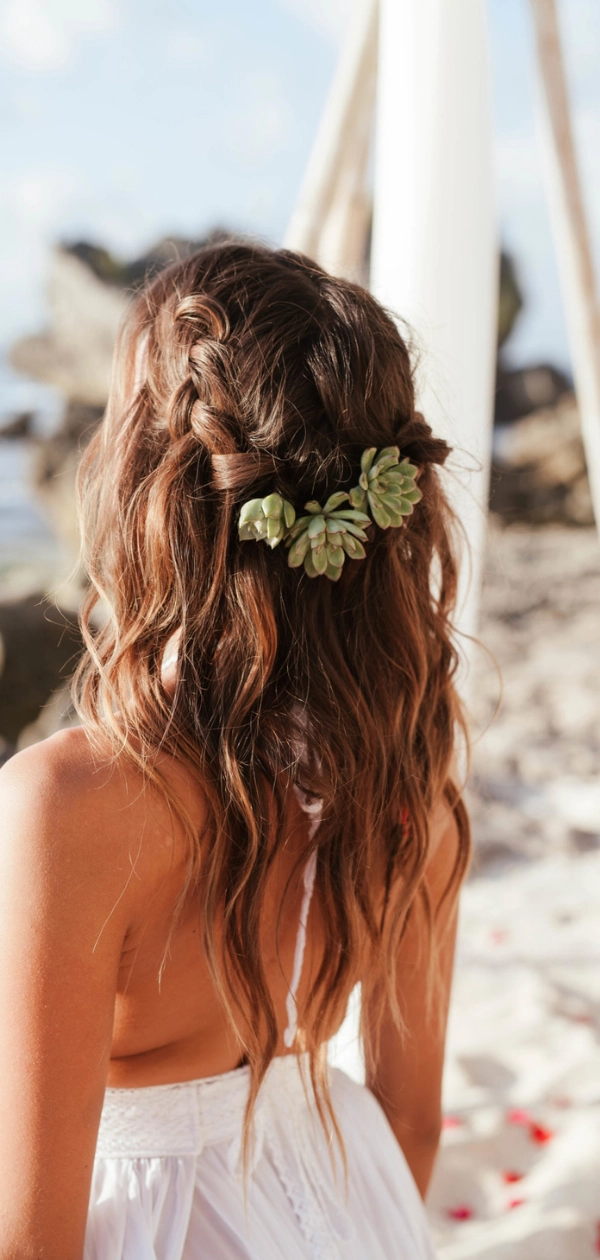Beach hair adorned with fresh tropical flowers