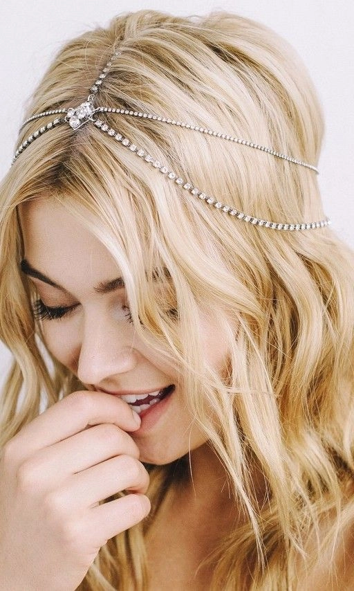 Beachy hairstyle featuring a woven headband for summer Woman with beach hair styled with a woven headband
