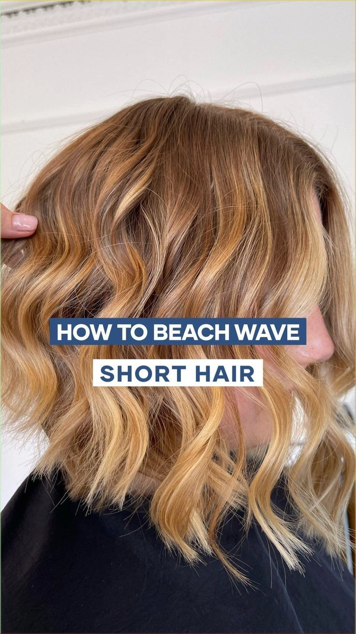 Woman with tousled short hair and beach waves at the shoreline