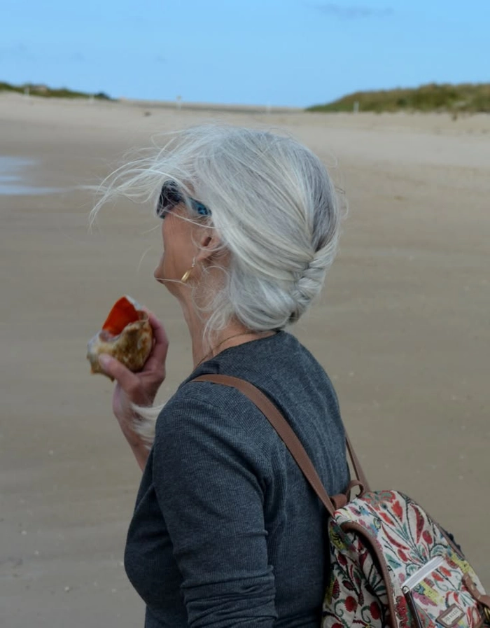 Elegant silver and gray beach waves styled for a carefree seaside look