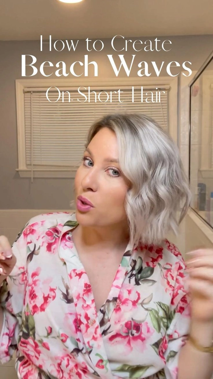 Effortless beach waves for women over 40 at the ocean Woman over 40 with a carefree beach wave hairstyle walking along the shoreline