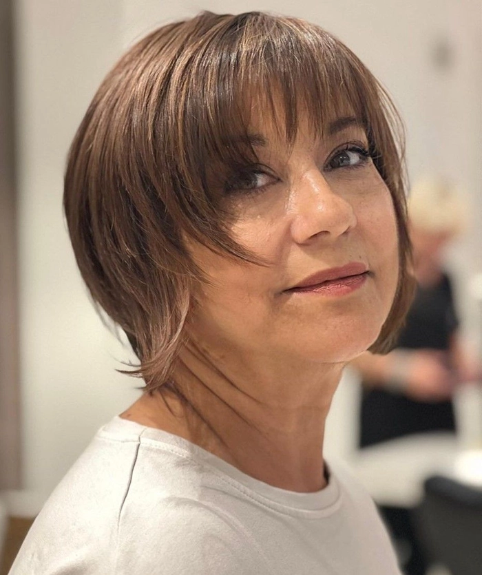Beach Hairstyles for Women Over 40 - Loose Waves with Braided Crown Elegant beach hairstyle for women over 40 with loose waves and a braided crown