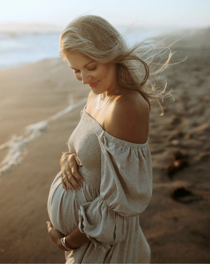 Beach Maternity Hairstyle for a Glowing Pregnancy Shoot Expecting mother with beachy waves at maternity photoshoot