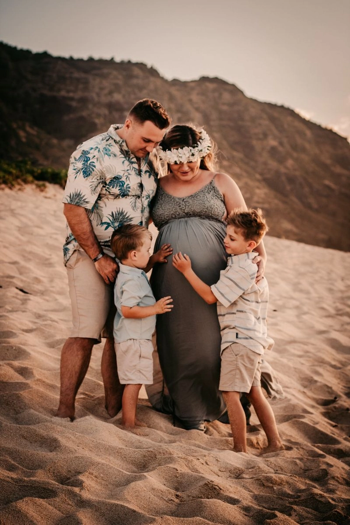 Beach maternity hair inspiration for a beautiful sunset photoshoot Maternity beach session hairstyle with flowing waves and soft sea breeze movement
