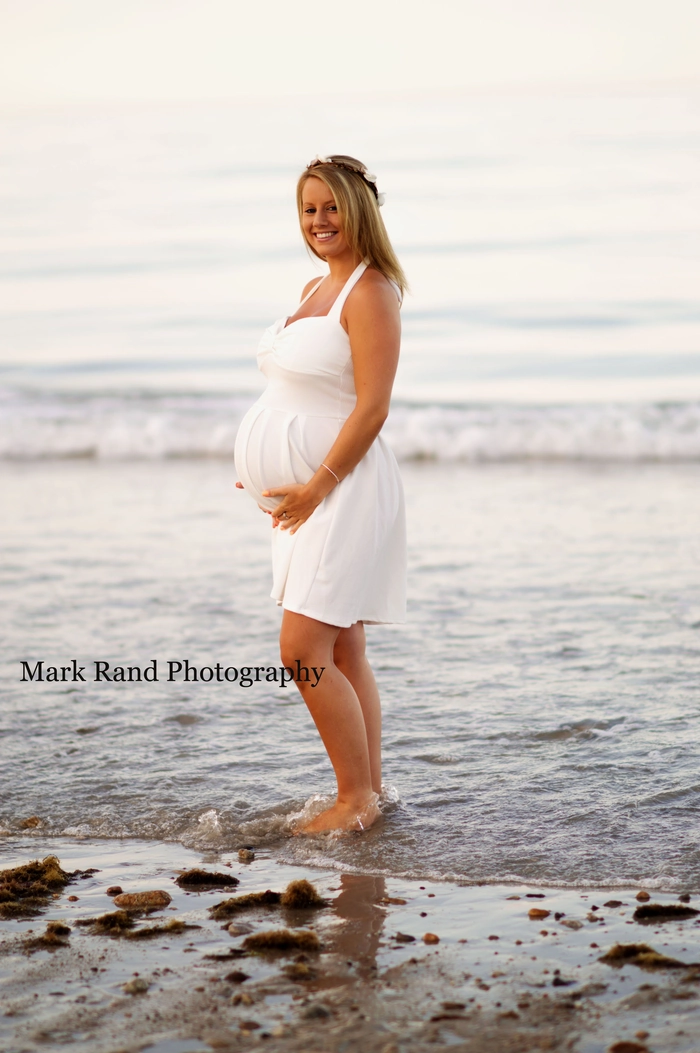 Beach Maternity Session Hair Inspiration for a Breezy Look beach maternity session hair styled in soft waves for a glowing photoshoot