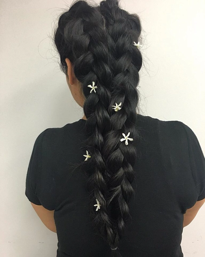Side braid hairstyle on sunny beach with ocean waves