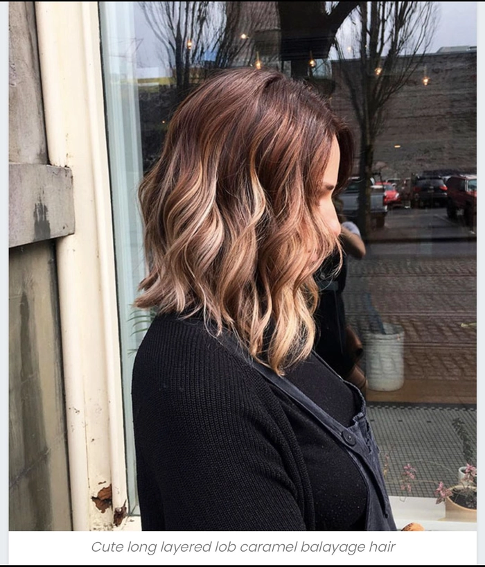 Woman with medium length hair styled into beachy waves