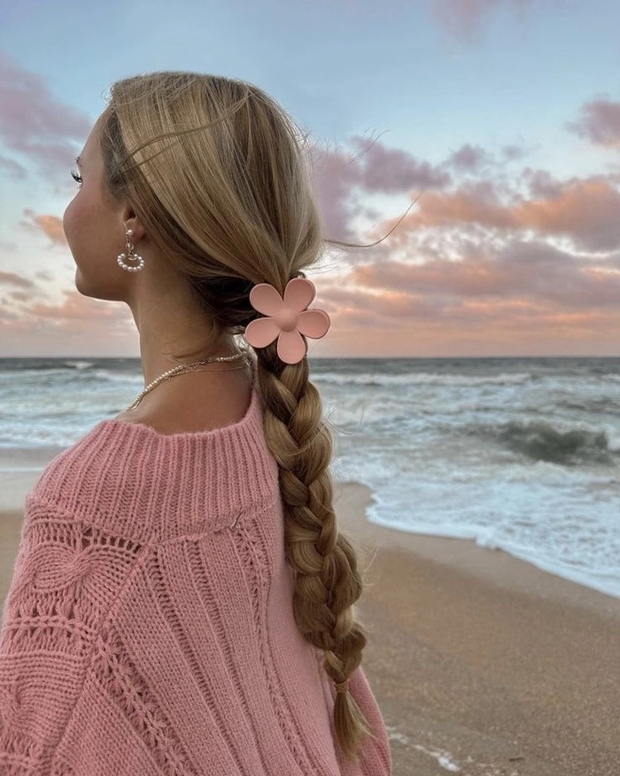 Bohemian beach hair aesthetics with tousled waves and floral accents