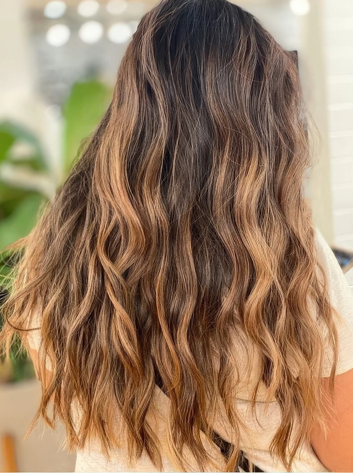 Brunette beach waves with dimension and natural volume