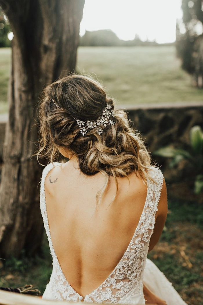 Coastal Boho Bridal Hairstyle with Soft Waves and Floral Accents Bride with loose beach waves and a delicate flower crown at seaside elopement