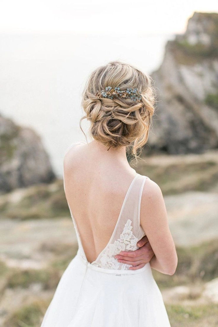 Coastal Elopement Hair Inspiration 7 - Beachy Waves with Ocean Wildflowers Romantic beach wedding hairstyle with loose waves and coastal flowers for an elopement ceremony