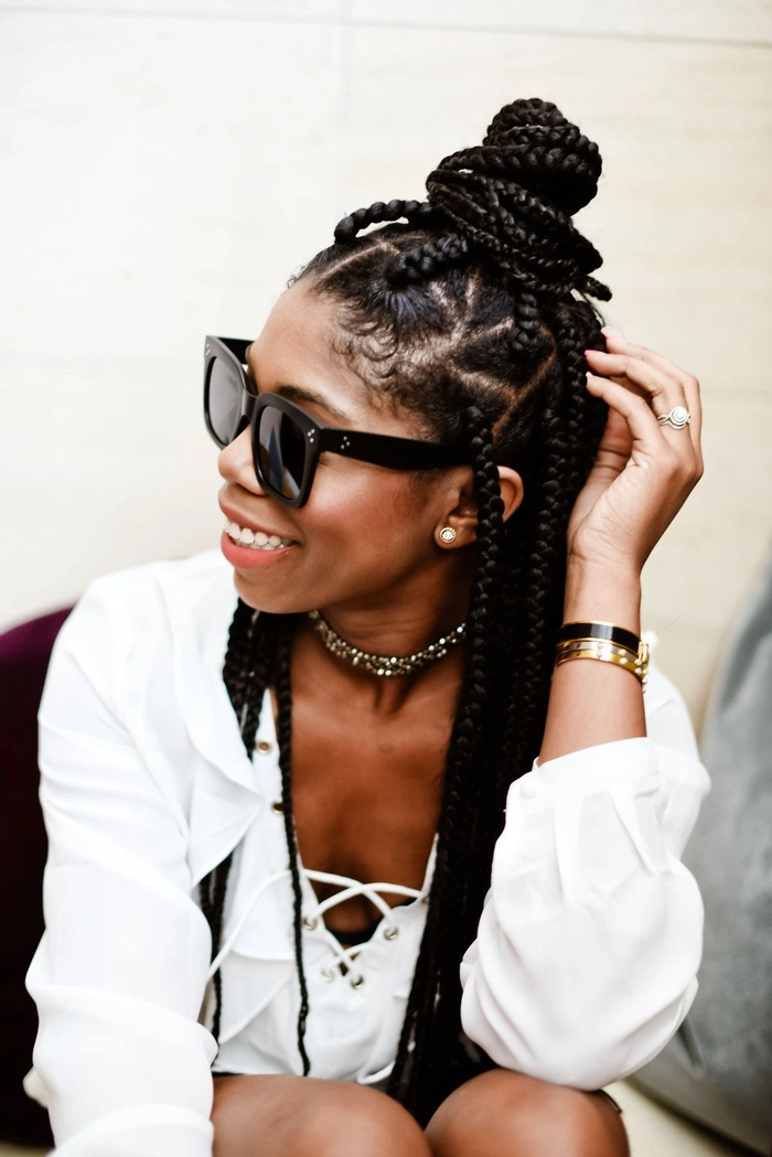 Coily Hair Beach Protective Styles for a Day at the Shore Two coily hair beach protective styles with braids and a sun hat