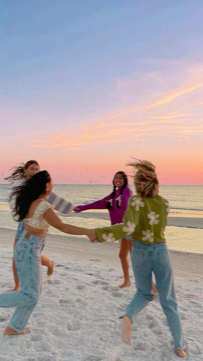 Spring break beach hairstyle featuring effortless surfer curls and salt spray texture College student enjoying spring break with windblown beach waves and a tousled ponytail