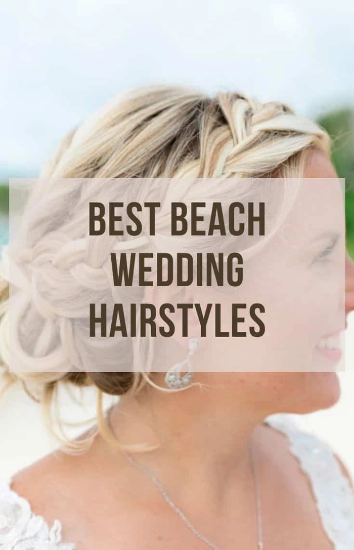 Romantic destination wedding beach hair with soft curls and flower accents Bride with flowing beach waves and tropical blooms for a seaside ceremony