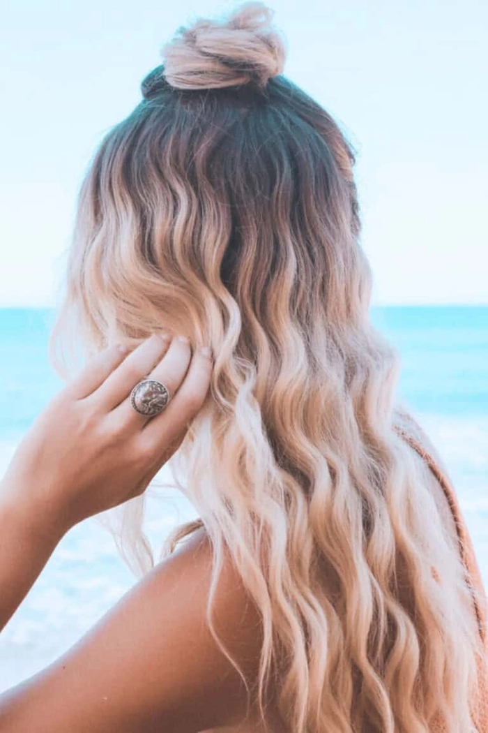 Edgy beach hairstyle with accessories like beads and clips