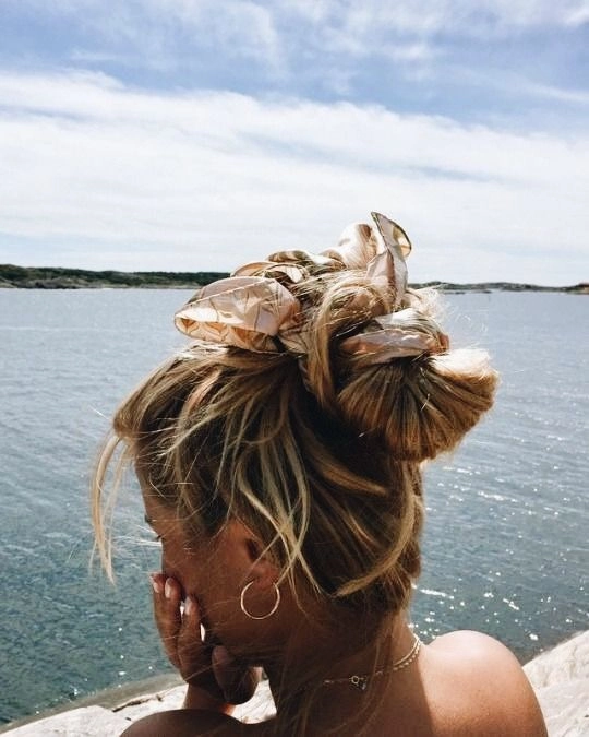 Edgy beach hair styled with bold accessories for a standout look