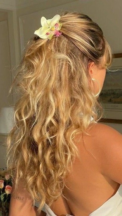 Edgy beach hair with bold accessories like metallic clips and braids