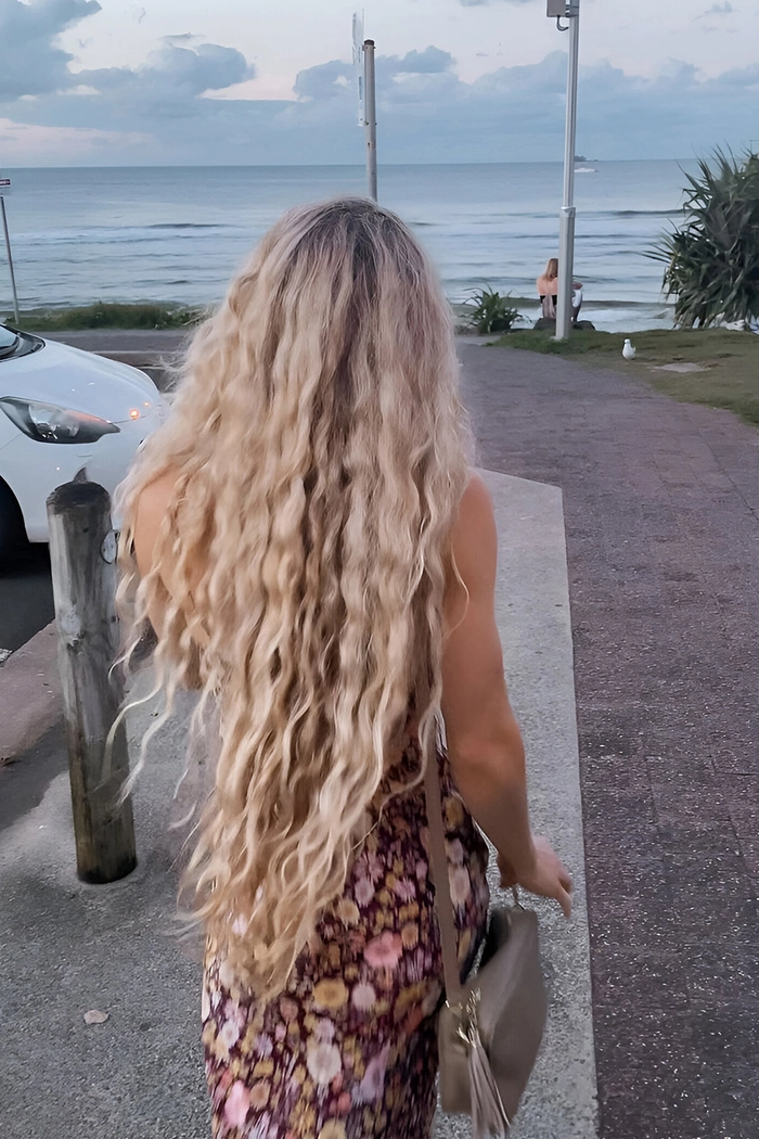 Effortless beach hair inspiration showing loose waves and a carefree style
