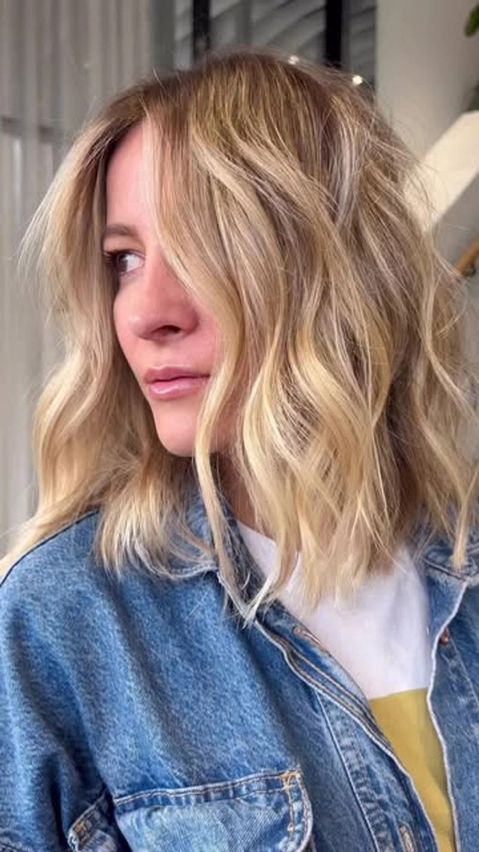 Elegant older woman with soft beach waves and natural gray hair styled beautifully