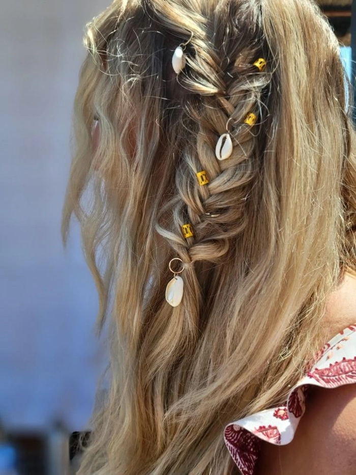 Woman with extra long beach braids cascading down her back