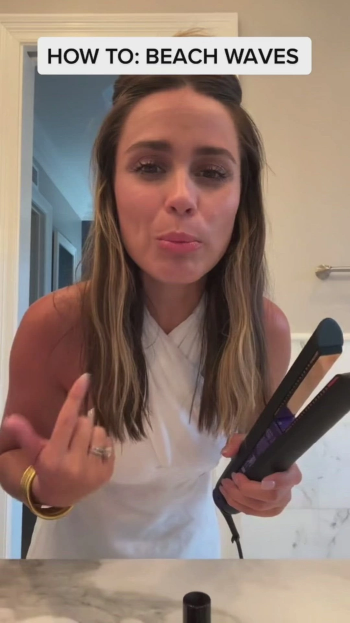 Step-by-step flat iron beach wave technique on wavy hair by the shore