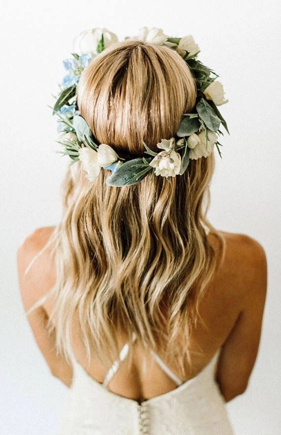 Soft beach waves adorned with a vibrant floral crown