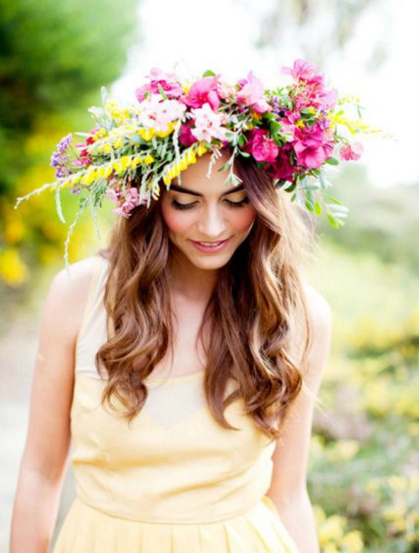 Stunning beach hairstyle with a vibrant floral crown, curls cascading in the sea breeze