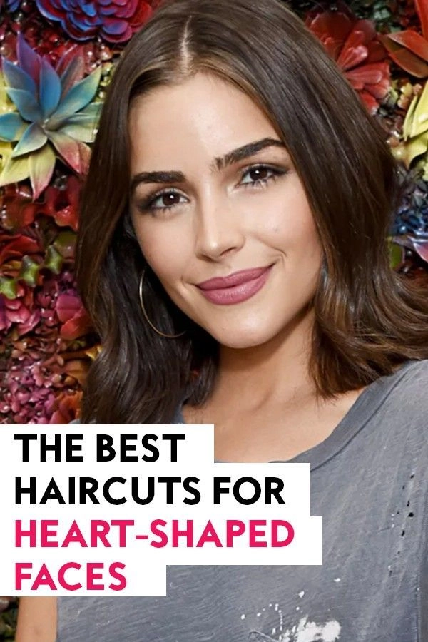 Beach hairstyle for heart-shaped face with hair framing in the wind Woman with heart-shaped face enjoying beach hair framing her features