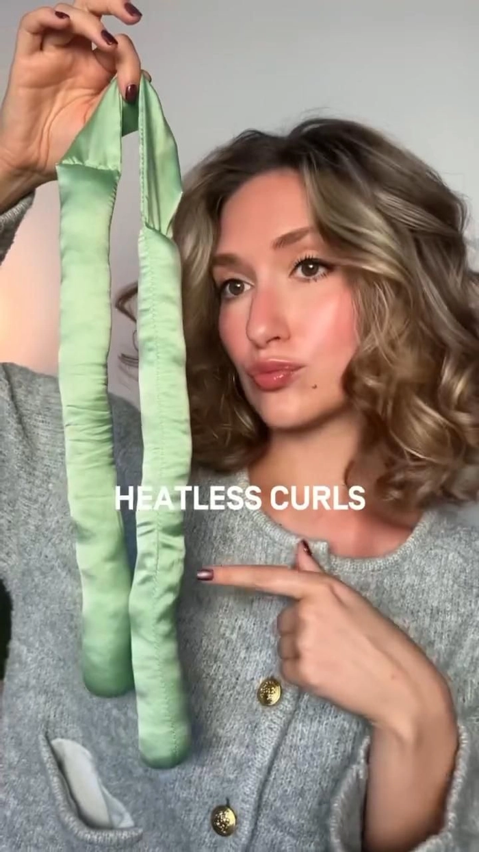 How to achieve effortless beach waves with heatless curling methods Woman with heatless beach curls using a fabric headband overnight