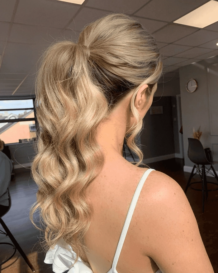 Woman with a stylish high ponytail at the beach