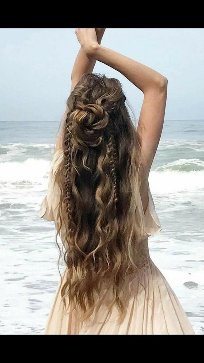 Bohemian beach hair aesthetics with messy waves and floral accents