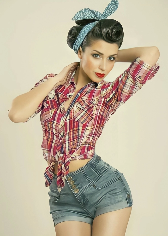 Vintage pinup girl with retro beach curls and a red bandana smiling at the shore