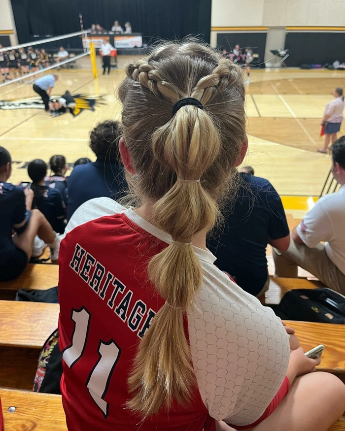 Woman with sweat proof beach hair for beach volleyball styled in a high ponytail