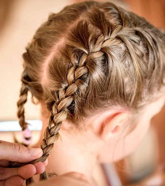 Beach Braids for Little Girls - Summer Hairstyle Idea Little girl with beach braids smiling by the ocean