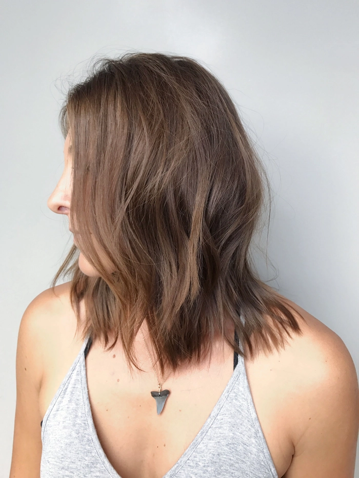 Trendy lob beach wave styles with tousled texture and sun-kissed highlights